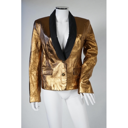 1030 - A lady's Dolce & Gabbana gold metallic leather jacket, with black lapels and leopard print lining, s... 