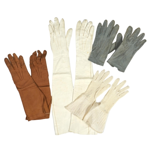 1038 - A pair of lady's Hermès skin gloves, boxed and three other pairs of gloves