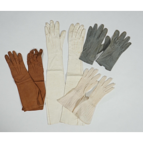 1038 - A pair of lady's Hermès skin gloves, boxed and three other pairs of gloves