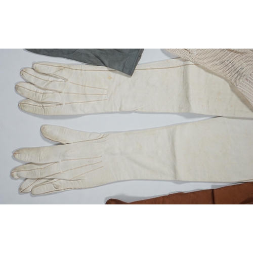 1038 - A pair of lady's Hermès skin gloves, boxed and three other pairs of gloves