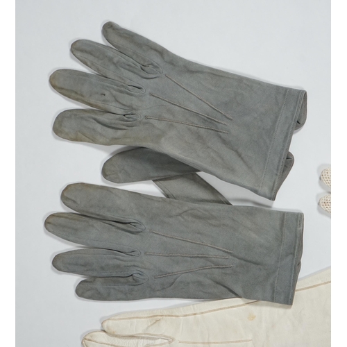 1038 - A pair of lady's Hermès skin gloves, boxed and three other pairs of gloves