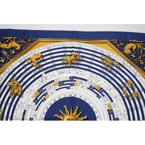 1040 - A Hermès Dies et Hore navy silk scarf, 90cm x 90cm