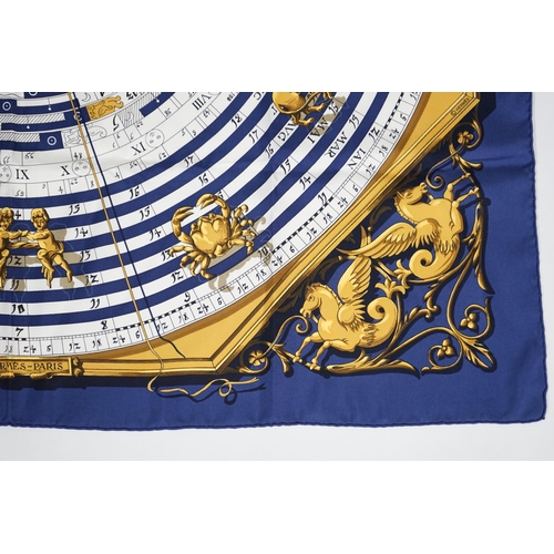 1040 - A Hermès Dies et Hore navy silk scarf, 90cm x 90cm