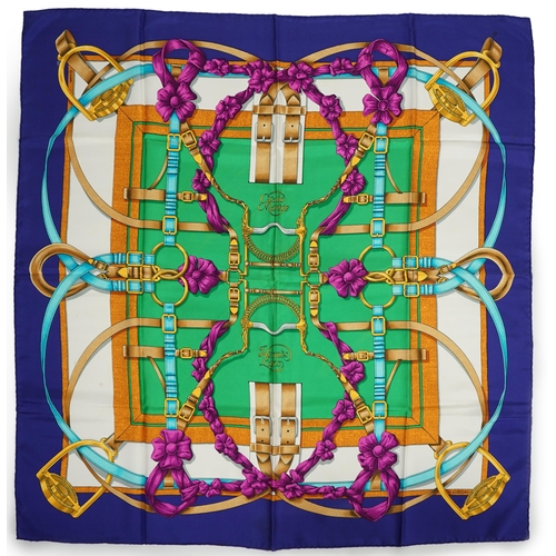 1042 - A Hermès 'Grand Manège' Henry d'Origny silk scarf, purples, golds, green, turquoise and pink colours... 