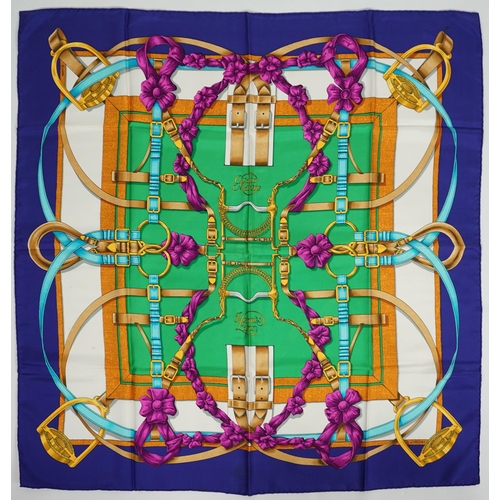 1042 - A Hermès 'Grand Manège' Henry d'Origny silk scarf, purples, golds, green, turquoise and pink colours... 