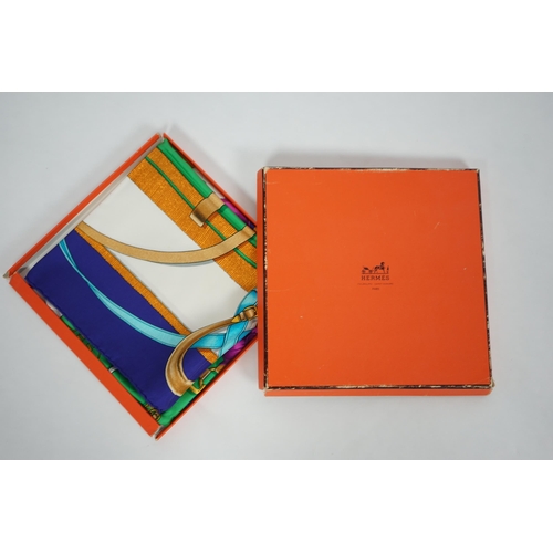 1042 - A Hermès 'Grand Manège' Henry d'Origny silk scarf, purples, golds, green, turquoise and pink colours... 