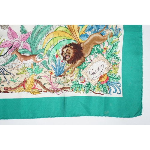 1052 - A Gucci 'Jungle' silk scarf, signed V. Accorneroa, printed with jungle creatures by Vittorio Accorne... 