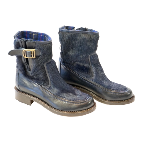 1056 - A pair of Chanel lady's navy blue leather calf hair pleated belted buckle boots, with blue tartan in... 