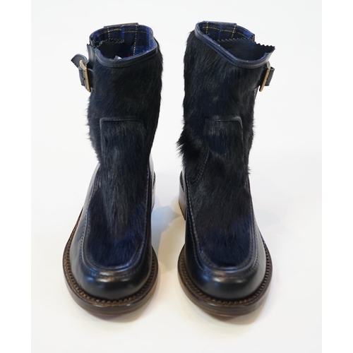 1056 - A pair of Chanel lady's navy blue leather calf hair pleated belted buckle boots, with blue tartan in... 