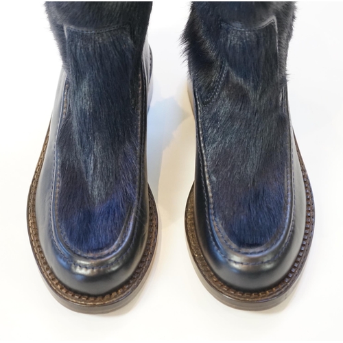 1056 - A pair of Chanel lady's navy blue leather calf hair pleated belted buckle boots, with blue tartan in... 