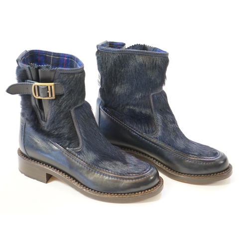 1056 - A pair of Chanel lady's navy blue leather calf hair pleated belted buckle boots, with blue tartan in... 