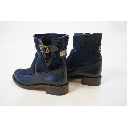 1056 - A pair of Chanel lady's navy blue leather calf hair pleated belted buckle boots, with blue tartan in... 