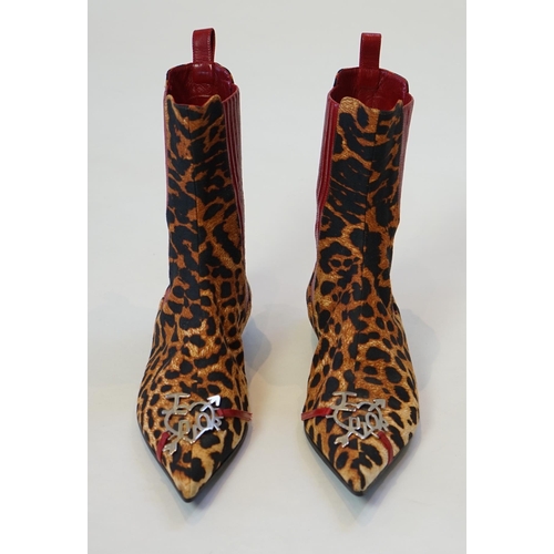 1061 - A pair of Christian Dior, Hardcore Collection, lady's leopard canvas ankle boots, with red leather t... 