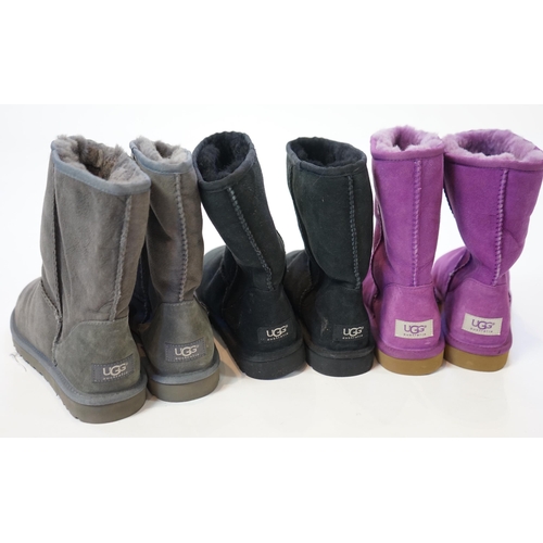 1063 - Three pairs of lady's sheepskin UGG boots, in grey, black and purple, size UK 7.5