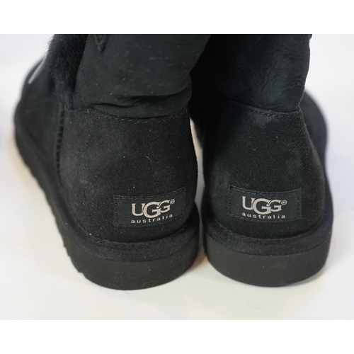 1064 - Three pairs of lady's low/mid height UGG sheepskin boots with side button design, in tan, black sued... 