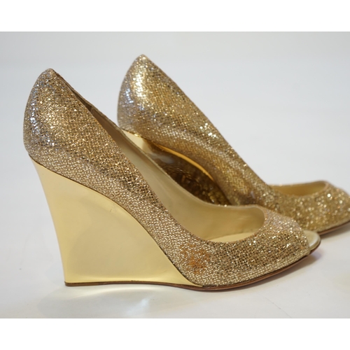 1069 - Two pairs of Jimmy Choo gold lady's heeled shoes, one sandal in gold leather and the other in textur... 