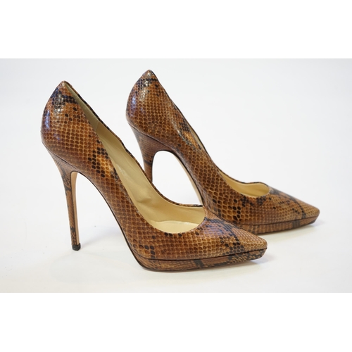 1073 - A pair of Jimmy Choo lady's snakeskin platform pumps in brown and black, 5" heels, with dust ba... 