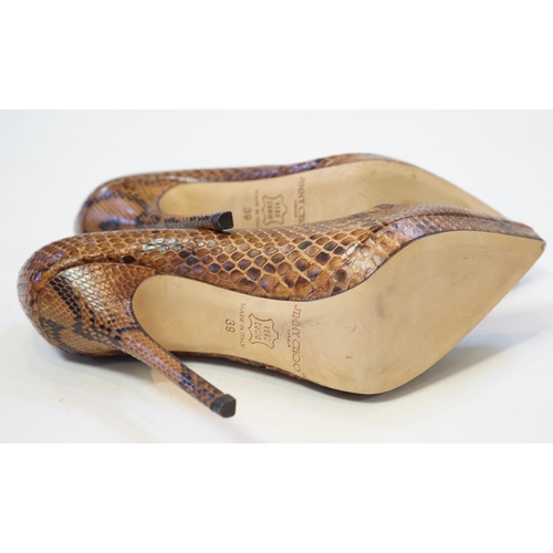 1073 - A pair of Jimmy Choo lady's snakeskin platform pumps in brown and black, 5" heels, with dust ba... 