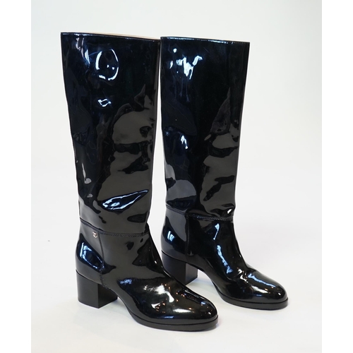 1075 - A pair of Chanel lady's black patent knee high mid heel rain boots, with CC to the outside ankle are... 