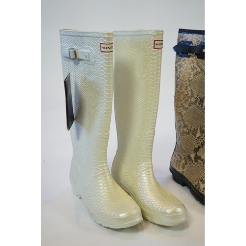 1076 - Two pairs of lady's Hunter snake-skin effect wellington boots, size UK 7