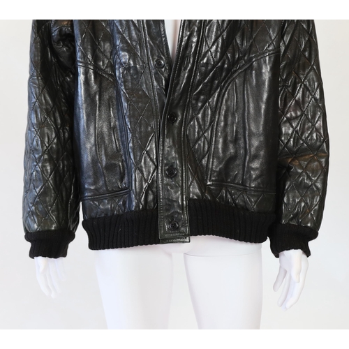 1081 - A Yves Saint Laurent Fourrures gentlemen's black quilted leather bomber jacket with fur collar and l... 