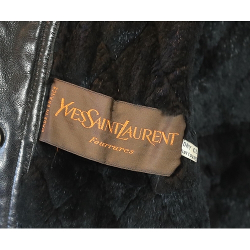 1081 - A Yves Saint Laurent Fourrures gentlemen's black quilted leather bomber jacket with fur collar and l... 