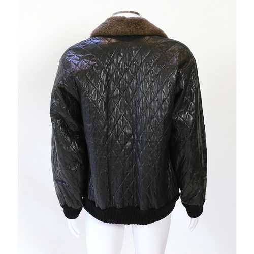 1081 - A Yves Saint Laurent Fourrures gentlemen's black quilted leather bomber jacket with fur collar and l... 