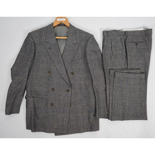 1089 - A Yves Saint Laurent rive gauche gentlemen's Prince of Wales check double breasted wool suit, approx... 