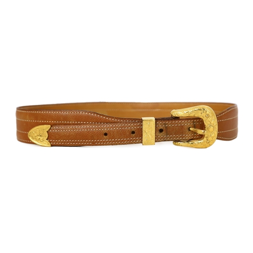 1101 - A Hermès lady's tan leather belt, with gold tone buckle and white stitching, size XS/Small