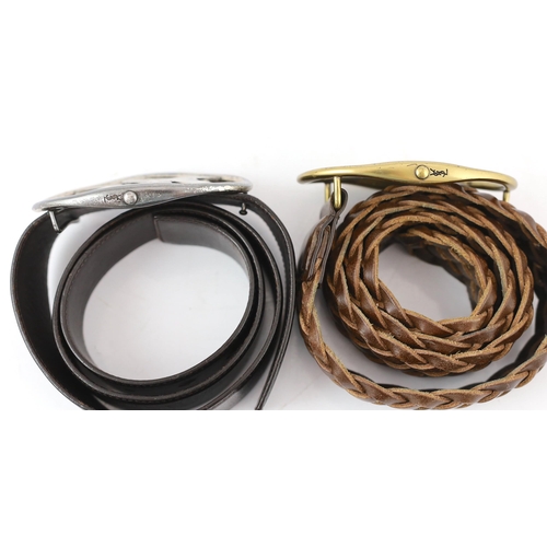 1102 - Two Yves Saint Laurent YSL logo belts, one braided tan leather with tarnished gold metalware and the... 