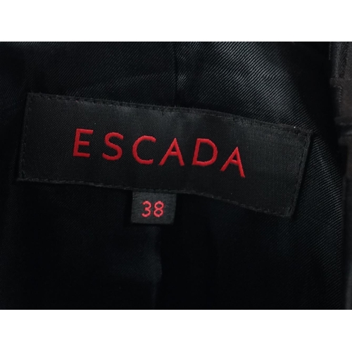 1110 - A Escada lady's monogram black trench coat, size 38