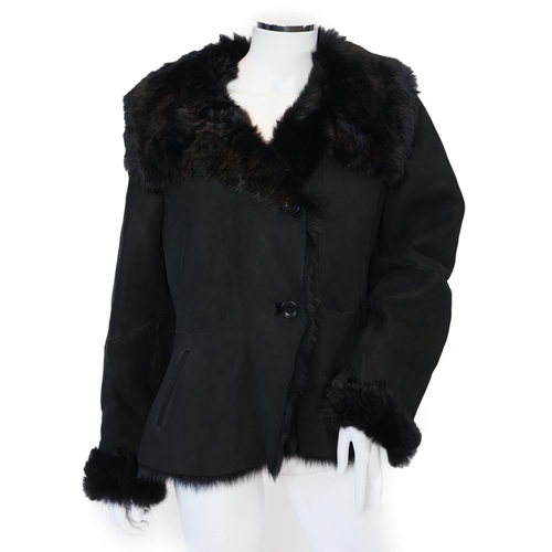 1112 - A lady's L K Bennett black shearling jacket, size Large