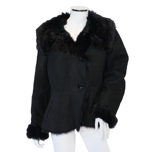 1112 - A lady's L K Bennett black shearling jacket, size Large