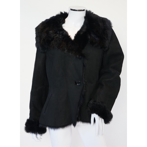 1112 - A lady's L K Bennett black shearling jacket, size Large