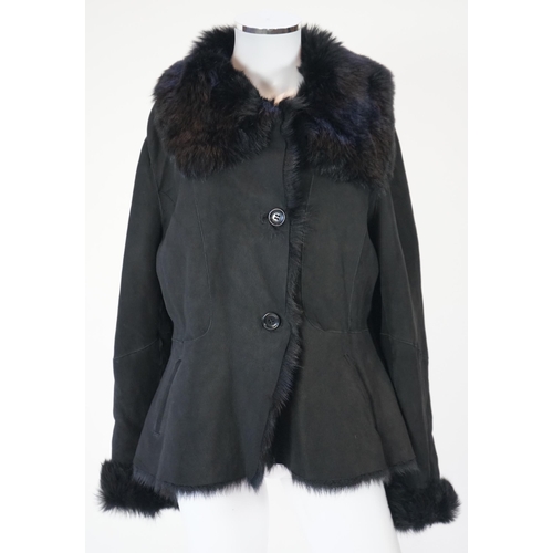 1112 - A lady's L K Bennett black shearling jacket, size Large