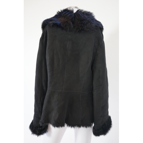 1112 - A lady's L K Bennett black shearling jacket, size Large