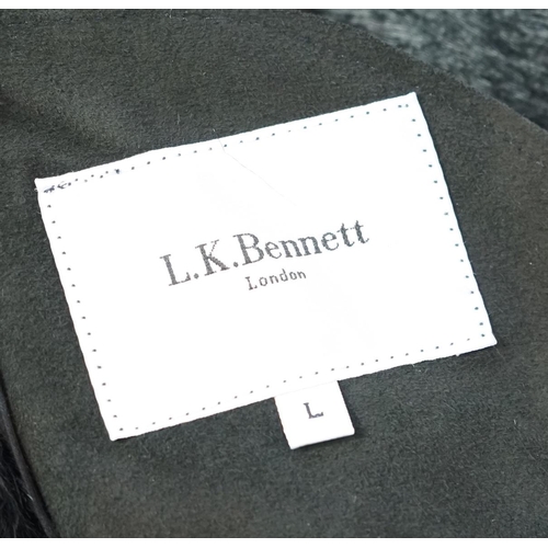 1112 - A lady's L K Bennett black shearling jacket, size Large