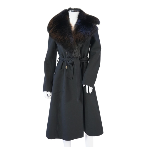 1113 - A Dolce & Gabbana lady's black wool coat with detachable fur collar, leopard print lining and tie be... 