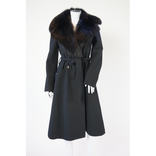 1113 - A Dolce & Gabbana lady's black wool coat with detachable fur collar, leopard print lining and tie be... 