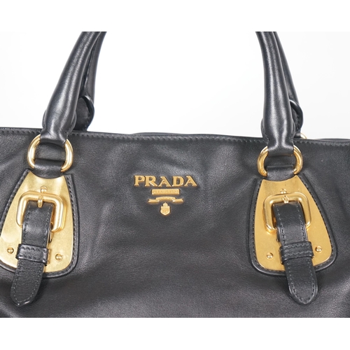 1118 - A Prada Vitello black leather bag with detachable strap, gilt metalware with dust bag, width 40cm, m... 