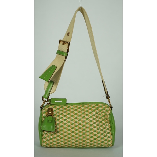 1125 - A Prada green and beige leather Intreccio Cube shoulder bag, zip closure with lock included. Woven c... 