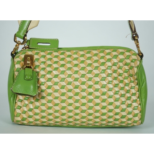 1125 - A Prada green and beige leather Intreccio Cube shoulder bag, zip closure with lock included. Woven c... 