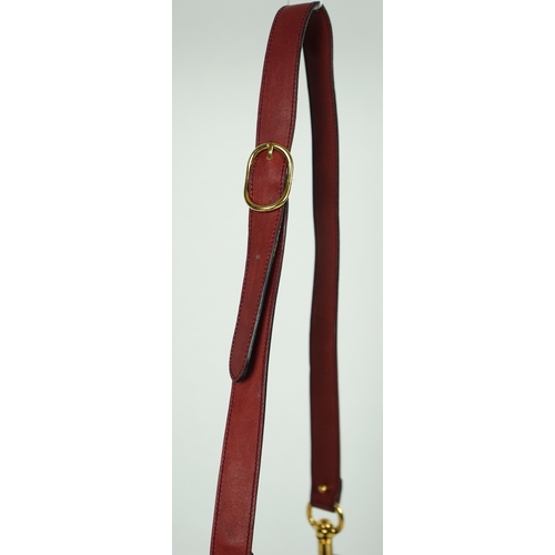 1126 - A vintage Gucci Blondie claret suede shoulder bag, Gucci gold toned intertwined double G logo is fro... 