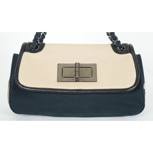 1128 - ** ** A Chanel No 5 Madamoiselle tri colour canvas and leather, chain shoulder handbag, with dust ba... 