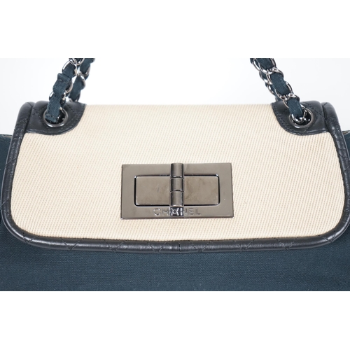 1128 - ** ** A Chanel No 5 Madamoiselle tri colour canvas and leather, chain shoulder handbag, with dust ba... 