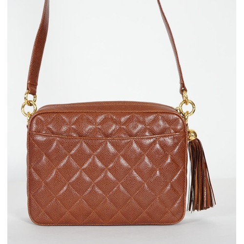 1129 - A Chanel vintage camera bag with tassel in brown quilted calf skin, matching leather shoulder strap,... 