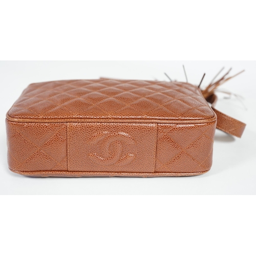 1129 - A Chanel vintage camera bag with tassel in brown quilted calf skin, matching leather shoulder strap,... 