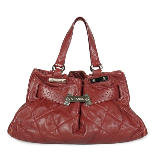 1130 - ** ** A Chanel burgundy leather buckled handle bag, with dust bag, Authentication no: 12244695 (with... 