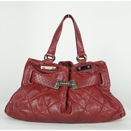 1130 - ** ** A Chanel burgundy leather buckled handle bag, with dust bag, Authentication no: 12244695 (with... 