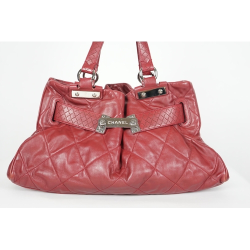 1130 - ** ** A Chanel burgundy leather buckled handle bag, with dust bag, Authentication no: 12244695 (with... 